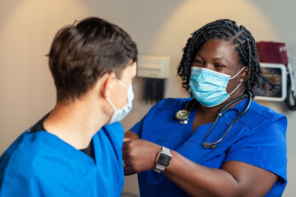 Nurses in blue scrubs